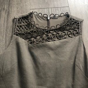 Fully lined fitted and flattering olive green dress with detailed neckline